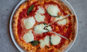 A margherita pizza on a plate